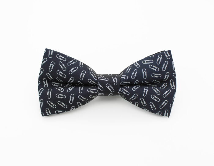 A Bowtie made from a fabric featuring silver paperclips on a black background